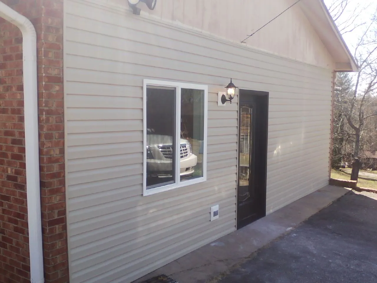 New vinyl siding and entry door on a room addition in Phoenicia